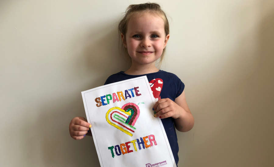 Evelyn from Alfreton holding separate together poster