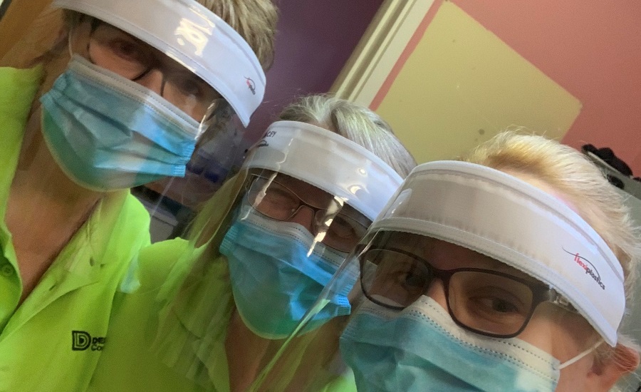 Three care workers in masks